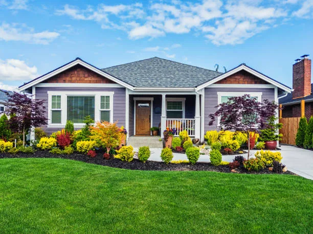 photo of a modern custom single level suburban home on a sunny summer day