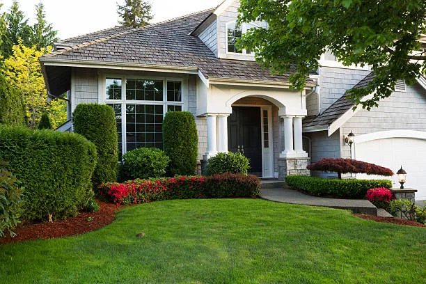 beautiful home exterior during late spring season with clean landscape